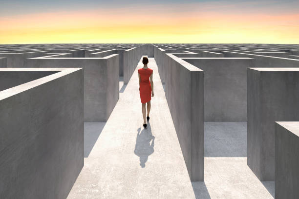 Businesswoman walks inside of a complex maze