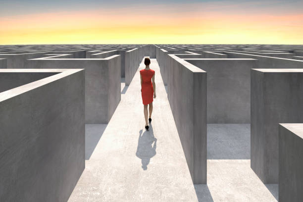 Businesswoman walks inside of a complex maze Businesswoman walks inside of a complex maze and looks for the way out, Digitally Generated Image. conceptual realism photos stock pictures, royalty-free photos & images