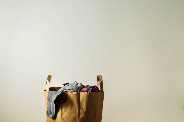 istock Paper bag with clothes donation 1194646429