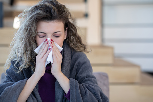 Cold And Flu. Portrait Of Ill Woman Caught Cold, Feeling Sick And Sneezing In Paper Wipe