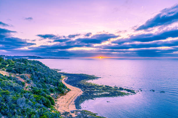 istock Sunset over ocean coastline - aerial view 1194647315