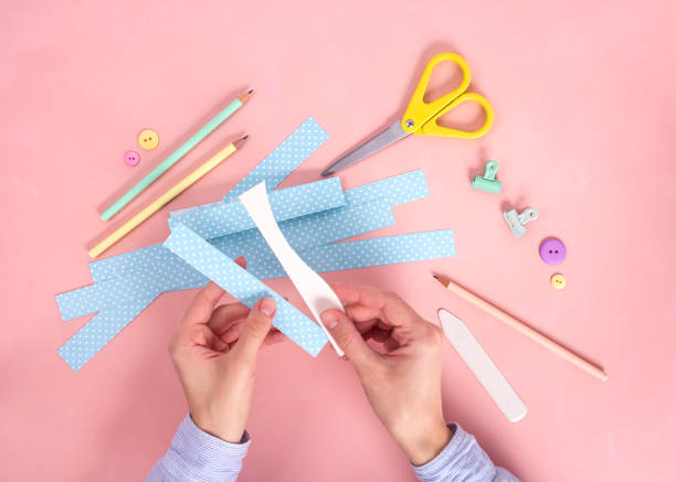 istock Scrapbooking master class. Diy. Make a Valentines day card whith paper hearts. Women's hobby. Craft supplies on the table. 1194647867