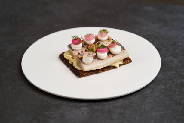 istock Smorrebrod with Baltic herring fish, smoked mousse and pickled onions 1194649210