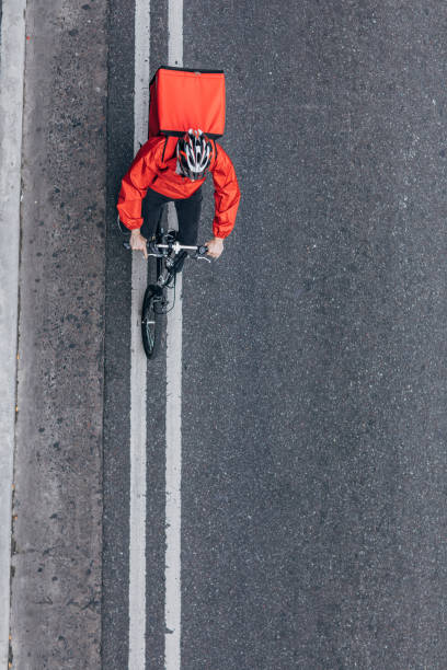 istock Food delivery guy on bicycle 1194649981