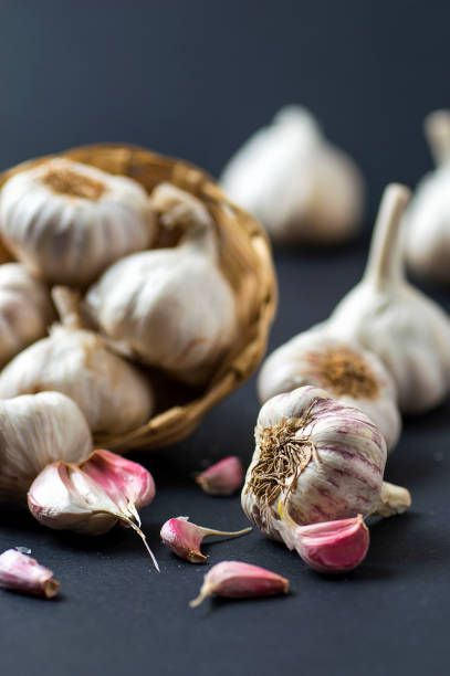istock Garlic Cloves and Garlic Bulb in Basket 1194650730