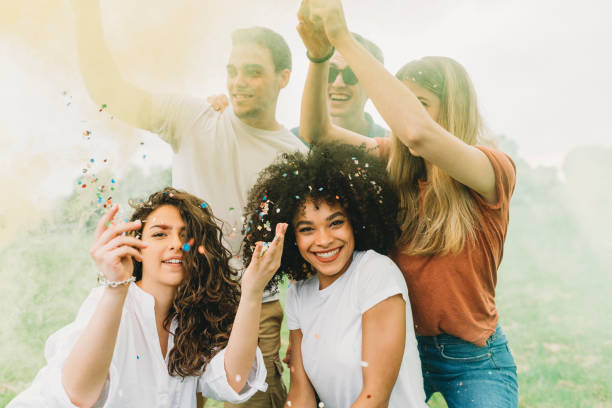 istock Group of friends having fun together with smoke bombs 1194652649