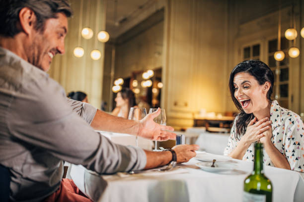 Gentleman proposing his girlfriend in restaurant