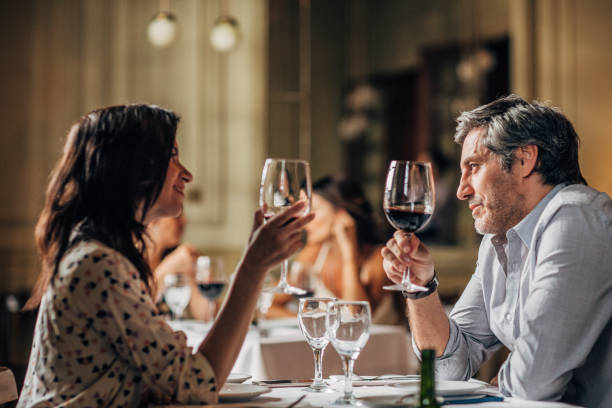istock Couple drinking wine in restaurant 1194654251