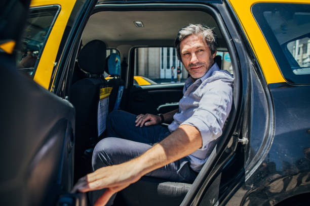 istock Mature man sitting in backseat of a cab 1194655232