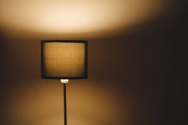 istock A lamp giving light in a room against the wall. 1194655452