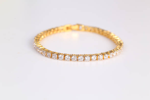 Beautiful golden Bracelet with diamonds Beautiful golden Bracelet with diamonds gold bangles pics stock pictures, royalty-free photos & images
