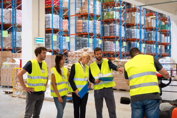 istock Warehouse staff meeting, workers with mnagers 1194658218