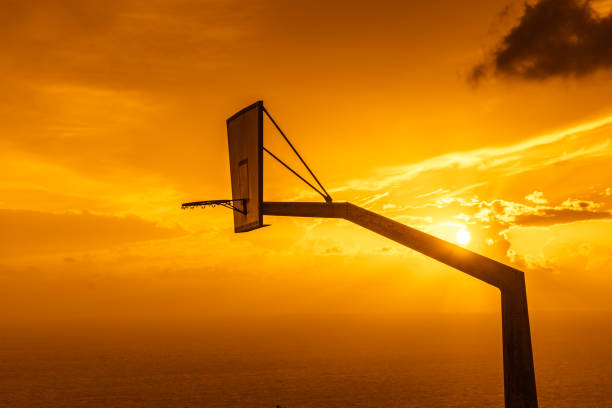 istock basketball basket against sunset sky 1194658233