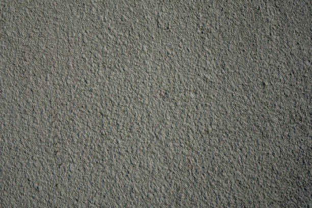 istock Rough gray painted plaster or stucco wall. Abstract grunge background with copy space. 1194661093