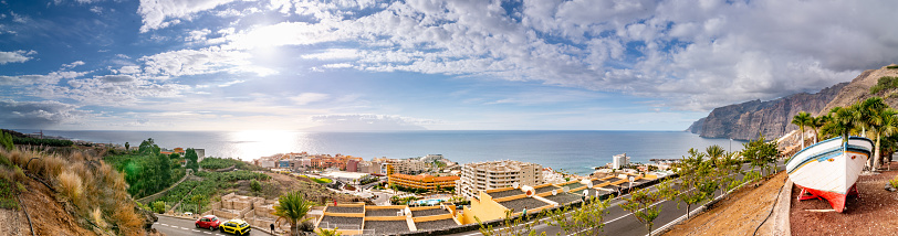 Aerial Panoramic View of the Beautiful Acantilados de Los Gigantes, Puerto de Santiago, Tenerife, Canary Islands, Spain - stock photo
