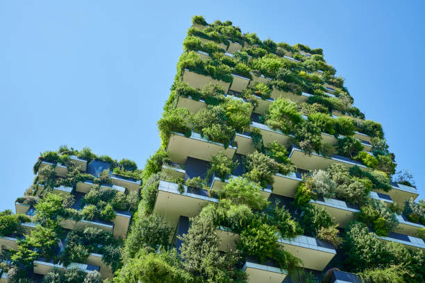 Vertical Forest in Milan Milan, Italy - June 16, 2019: residential high rise buildings with lots of shrubs and perennials on the balconies in the Isola district. They are called "Bosco Verticale" meaning Vertical Forest. green skyscraper stock pictures, royalty-free photos & images