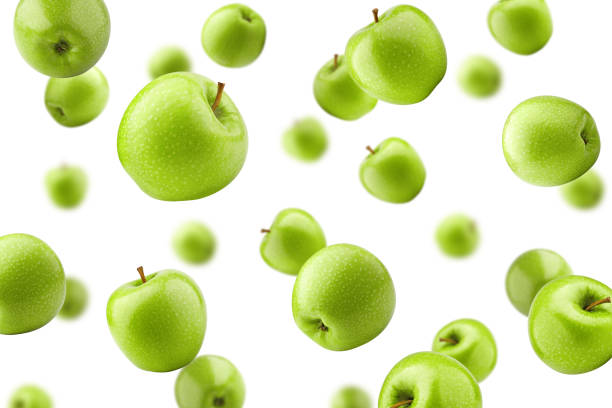 istock Falling green juicy apple isolated on white background, selective focus 1194662653