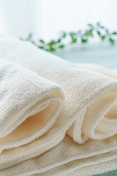 istock Stack of clean towels on wooden background 1194665413