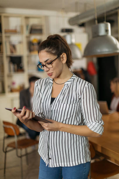 istock Young college girl in modern classroom 1194665636
