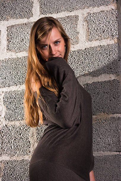 Woman and wall stock photo