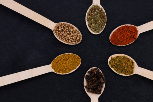 istock Colourful various herbs and spices on dark background. Top view 1194666623