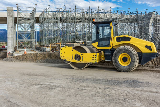 istock Construction of a highway and an overpass with heavy machinery 1194666937