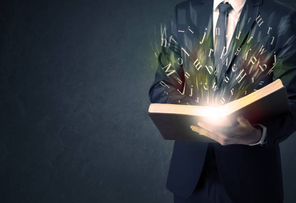istock Businessman holding a book. 1194667653