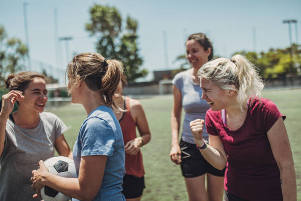 Female soccer team outdoors on soccer field Group of women, female soccer players together outdoors on soccer field. football player girlfriend stock pictures, royalty-free photos & images