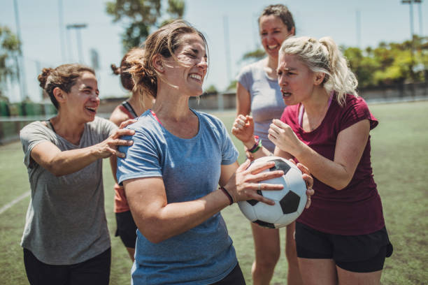 Women soccer team outdoors on soccer field Group of women, female soccer players together outdoors on soccer field. football player girlfriend stock pictures, royalty-free photos & images