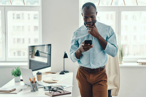 istock Confident young African man in shirt 1194669141