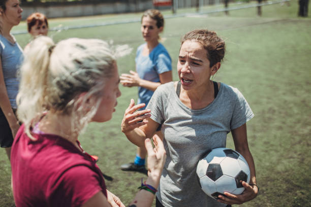 Women soccer players on soccer field Group of women, female soccer players together outdoors on soccer field. football player girlfriend stock pictures, royalty-free photos & images