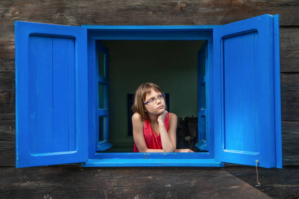 Girl looking out the window