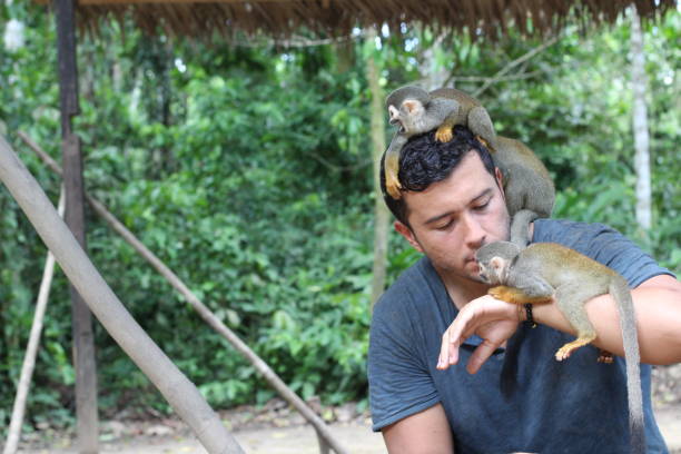 istock Cute zookeeper talking to the animals 1194670673