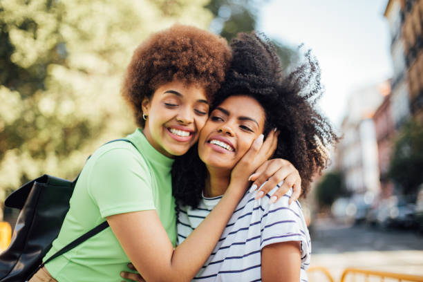 istock Besties embracing on the street 1194671498