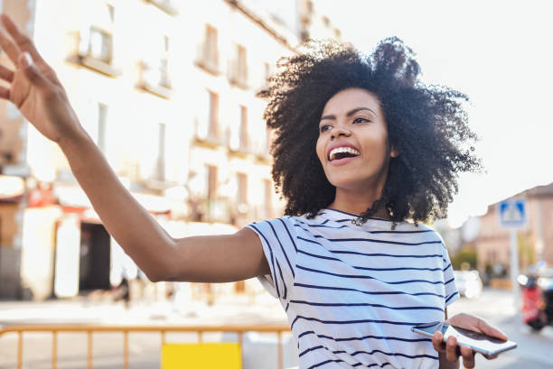 istock Beautiful girl calling a cab 1194671571