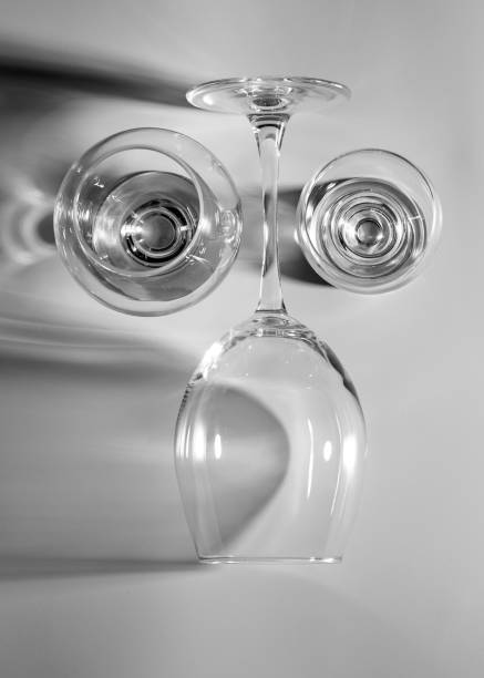 Wine glasses cast long shadows.