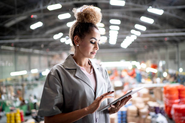 istock Woman using digital tablet and working in the industry 1194674221