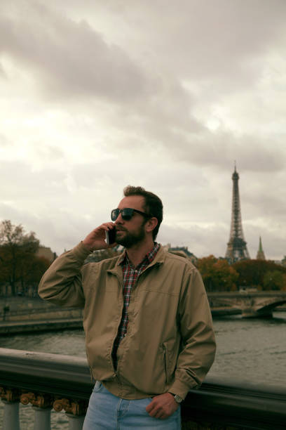 istock Handsome man talking on cellphone and enjoying in Paris. 1194676685