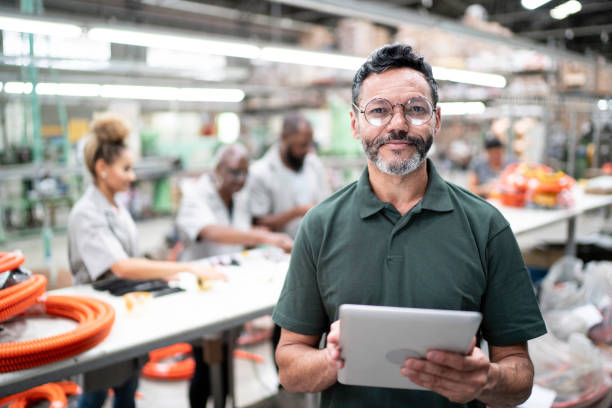 istock Portrait of a manager using digital tablet in a factory 1194676772
