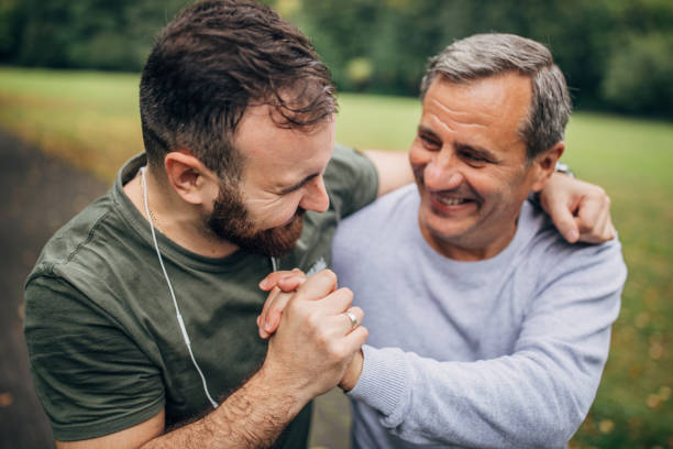 istock Father and son jogging in park 1194677159