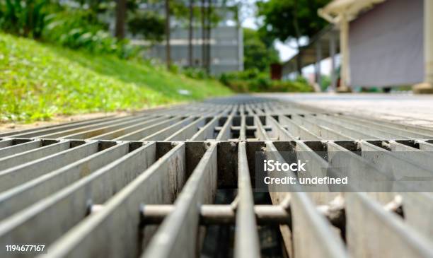 Close Up View Of A Sidewalk Drainage Gate Stock Photo - Download Image Now - Sewage Treatment Plant, Sewage, Drainage