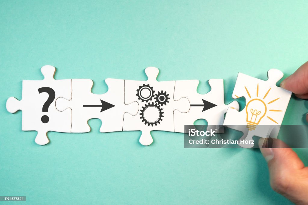 finding solution for a problem concept with jigsaw puzzle pieces finding solution for a problem, analysis concept with top view of jigsaw puzzle pieces Solution Stock Photo