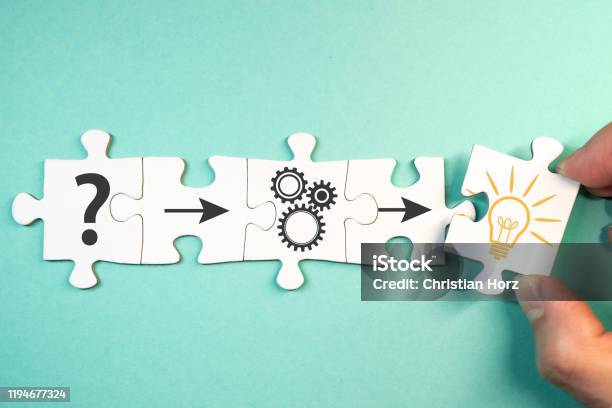 Finding Solution For A Problem Concept With Jigsaw Puzzle Pieces Stock Photo - Download Image Now