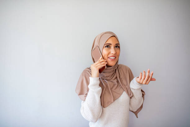 istock Hijab asian woman using mobile phone. 1194678049