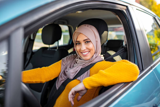 istock Arab women driving car. 1194678331