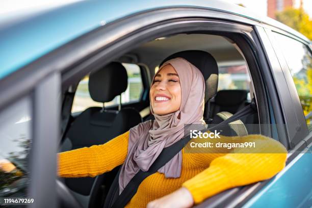 Beautiful Woman With Hijab Driving A Car Stock Photo - Download Image Now - Car, New, Driving
