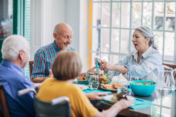 istock Seniors having meal in their retirement home 1194679663