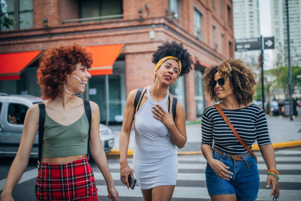 istock Three young women walking outdoors 1194680021