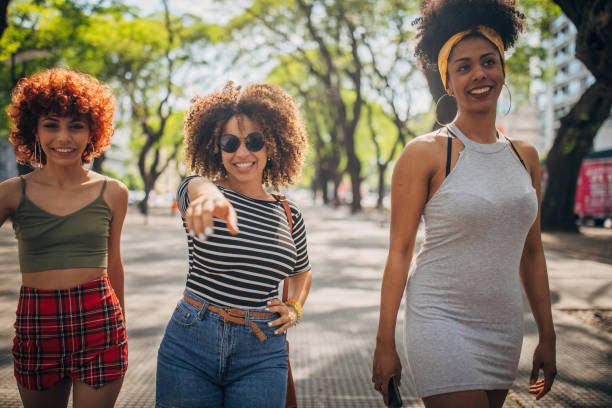 istock Three young women walking outdoors 1194681373