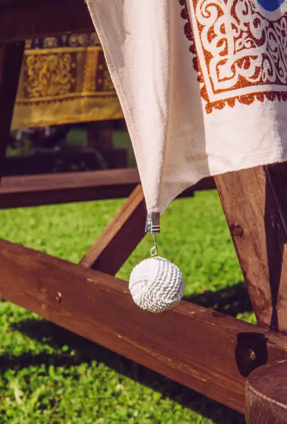 Photo of Clip tablecloth weights attached to a table cloth outdoors these are designed to hold your table cloth steady on windy day when you want to eat outside.